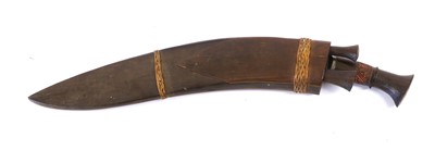 Lot 139 - A Nepalese Kukri, the 43cm steel blade with...