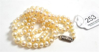 Lot 253 - A cultured pearl necklace, the graduated pearls part knotted and strung to an Art Deco style clasp