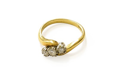 Lot 154 - An 18 Carat Gold Diamond Three Stone Twist...
