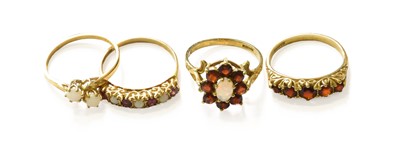 Lot 162 - Four 9 Carat Gold Opal and Garnet Rings,...