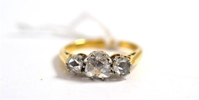 Lot 258 - A diamond three stone ring, three graduated rose cut diamonds in white claw settings, on a...