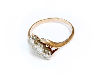 Lot 181 - A Diamond Three Stone Twist Ring, unmarked,...