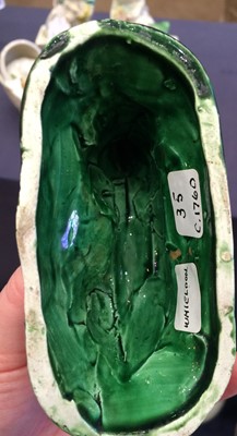 Lot 77 - A Green-Glaze Earthenware Model of a Hound,...