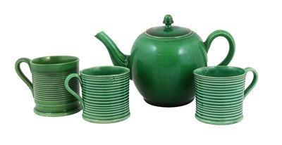 Lot 53 - A Green-Glazed Earthenware Teapot and Cover,...