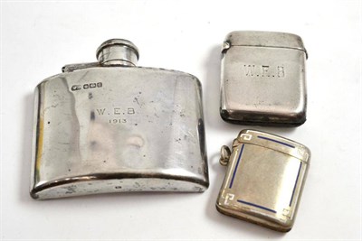 Lot 273 - A silver and enamel vesta case, another and a small hip flask