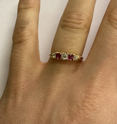 Lot 48 - An 18 Carat Gold Ruby and Diamond Five Stone...