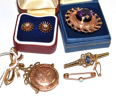 Lot 279 - A swivel locket brooch, three brooches and a pair of 9ct gold diamond earrings