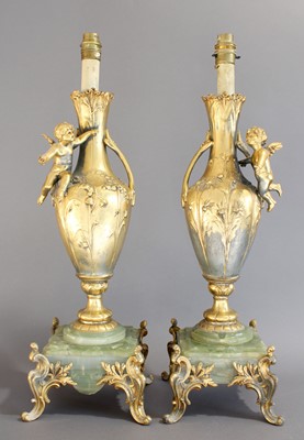 Lot 18 - A Pair of French Gilt Metal and Onyx Lamp...