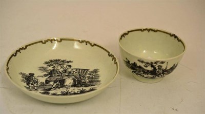 Lot 29 - A First Period Worcester Porcelain Tea Bowl and Saucer, circa 1765, printed in black by John Sadler