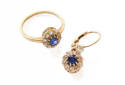 Lot 134 - A Sapphire and Diamond Cluster Ring, finger...