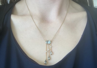 Lot 2146 - An Aquamarine and Seed Pearl Necklace the oval...