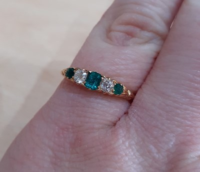 Lot 2131 - An Emerald and Diamond Five Stone Ring two old...