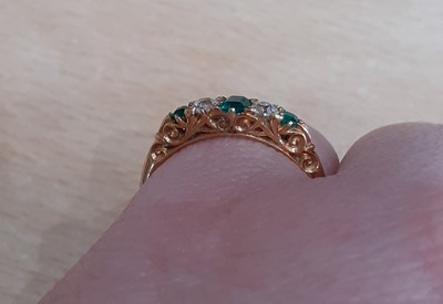 Lot 2131 - An Emerald and Diamond Five Stone Ring two old...