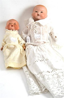 Lot 313 - Two Armand Marseille bisque flange head baby dolls