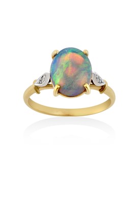 Lot 2150 - An Opal and Diamond Ring the oval cabochon...