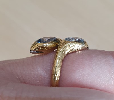 Lot 2101 - A Diamond Snake Ring the serpent heads inset...