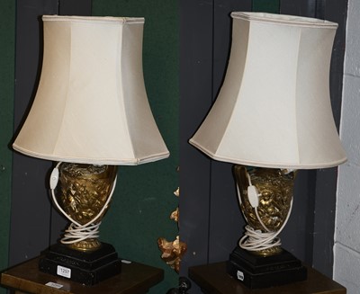 Lot 1297 - A Pair of Gilt Metal Lamps, of twin-handled...