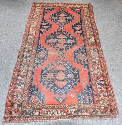 Lot 1107 - A Karabagh Rug, the madder serrated field with...