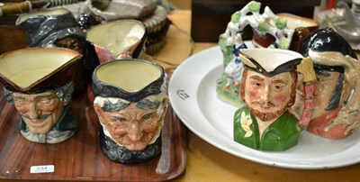 Lot 334 - Six Royal Doulton character jugs, a Staffordshire figure, a music character jug and an oval...