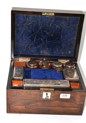 Lot 336 - A 19th century rosewood travelling case with cut glass jars and silver plated fittings