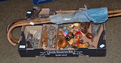 Lot 339 - A box of collectables including stone tools, two planes, Mexican bolas, Black Forest figures...