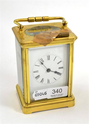 Lot 340 - A repeating carriage clock in a brass obis case, dial cracked