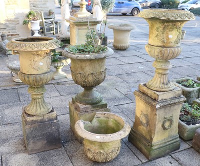 Lot 1166 - Four Composition Sandstone Garden Urns,...