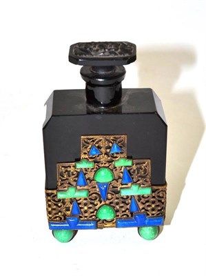 Lot 347 - An Art Deco glass scent bottle in a gilt metal and stone set base