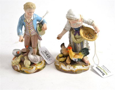 Lot 348 - A pair of late Meissen figures of a girl feeding chickens and boy feeding ducks (a.f.)