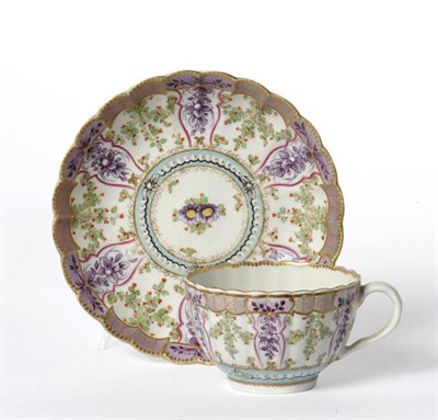 Lot 36 - A First Period Worcester Porcelain Hop Trellis Pattern Teacup and Saucer, circa 1775, of fluted...