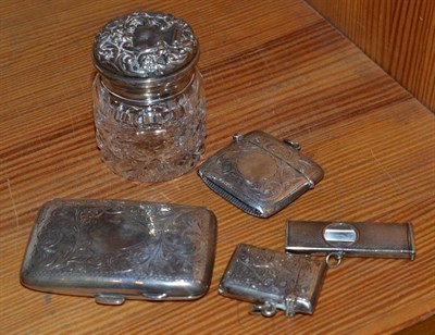 Lot 361 - A silver cigar cutter, two silver vesta cases, a cigarette case and a toilet jar with silver cover