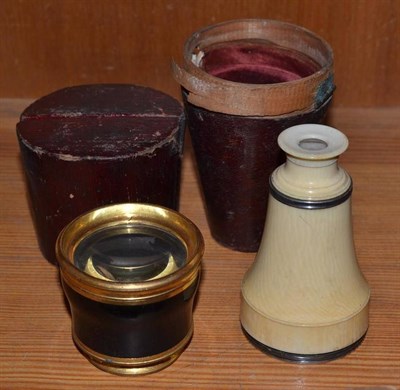 Lot 362 - An ivory mounted monocular and another, ebonised, both in leather cases (a.f.)