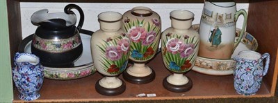 Lot 376 - A shelf of decorative ceramics and glass comprising a Royal Doulton Dickens Ware toilet ewer...