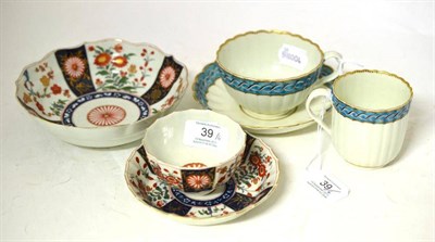 Lot 39 - A First Period Worcester Porcelain Fluted Tea Bowl and Saucer, circa 1770, painted with the...