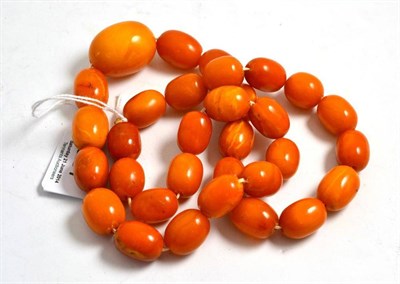 Lot 387 - String of amber beads