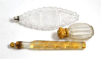 Lot 393 - A 19th century cut glass scent bottle, another with a fluted body and a gilt metal mount and an...