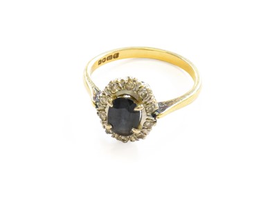 Lot 321 - An 18 Carat Gold Sapphire and Diamond Cluster...