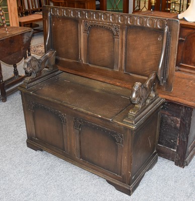 Lot 1341 - A 20th Century Oak Monks Bench, with lion...