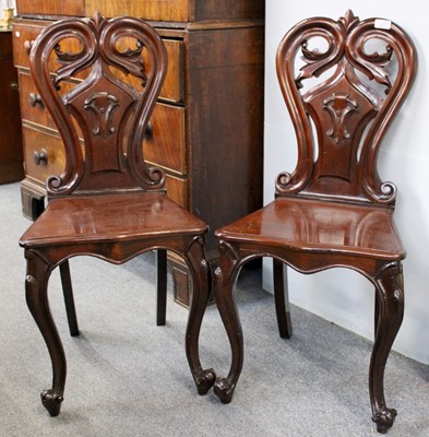 Lot 1259 - A Pair of Mahogany Hall Chairs, with pierced...