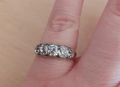 Lot 2059 - A Diamond Five Stone Ring the graduated old...