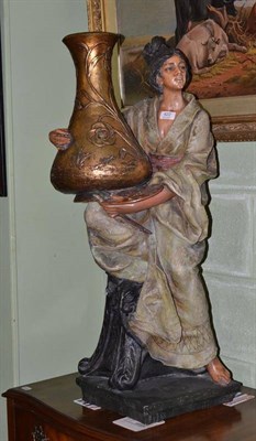 Lot 422 - Large terracotta standing figure of an Eastern lady holding a vase and artist's pallet