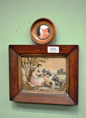 Lot 429 - A 19th century needlework picture of a boy and girl, in rosewood frame and a miniature on ivory...