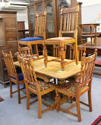 Lot 1306 - A Carved Oak Drawer Leaf Dining Table, first...