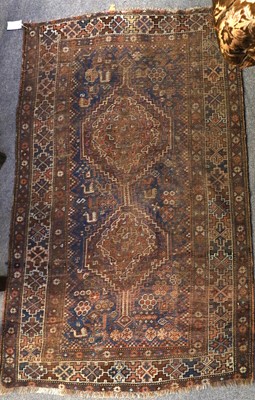 Lot 1003 - A Baluch Rug, the field with urns issuing...