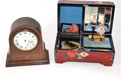 Lot 436 - An Edwardian mahogany and boxwood strung timepiece and a musical jewellery casket with a small...