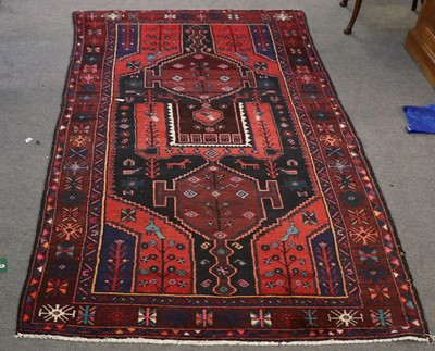 Lot 1004 - A Kurdish Long Rug, the charcoal field with...