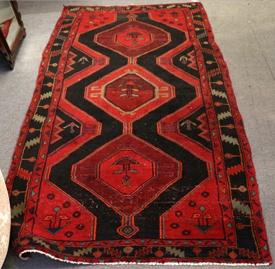 Lot 1005 - A Kurdish Long Rug, the charcoal field with 3...