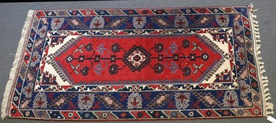 Lot 1010 - A Dosemealti Rug, the crimson field of...