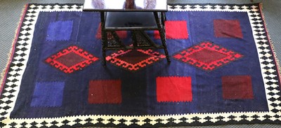 Lot 1012 - A Kashgai Kilim, the indigio field of three...