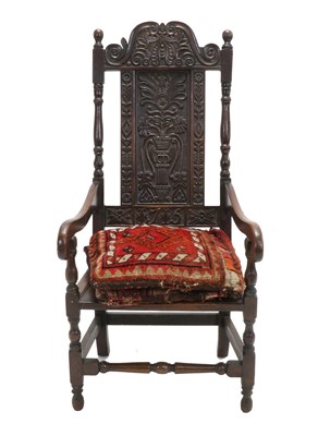 Lot 605 - An 18th Century Joined Oak Armchair, carved...